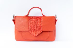 Orange/red leather handbag.
